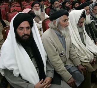 Delegation members of Pakistani Islamist leader Soofi Mohammad attend a meeting in Peshawar
