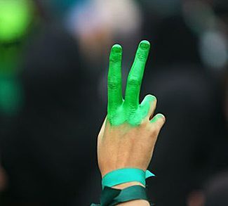 Peace finger symbol painted green