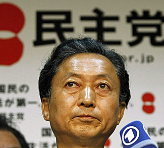 Japan's Democratic Party leader Hatoyama speaks to reporters at the party headquarters in Tokyo