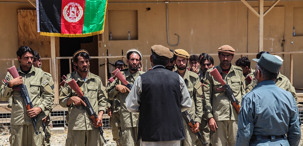 Abdul Wahab, center, the Khogyani district governor, talks to an Afghan Local Police (ALP) class during an ALP graduation ceremony in the Khogyani district, Nangarhar province, Afghanistan, June 1, 2013., modified, https://commons.wikimedia.org/wiki/File:Abdul_Wahab,_center,_the_Khogyani_district_governor,_talks_to_an_Afghan_Local_Police_%28ALP%29_class_during_an_ALP_graduation_ceremony_in_the_Khogyani_district,_Nangarhar_province,_Afghanistan,_June_1,_2013_130601-A-RE111-209.jpg
