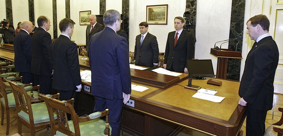 cc THE KREMLIN, MOSCOW. Before the start of a special meeting following the terrorist attacks in the Moscow metro. The meeting’s participants observed a minute of silence in memory of the victims., kremlin.ru, modified, https://ru.wikipedia.org/wiki/%D0%A4%D0%B0%D0%B9%D0%BB:Medvedev_-_2010_Moscow_Metro_bombings.jpg