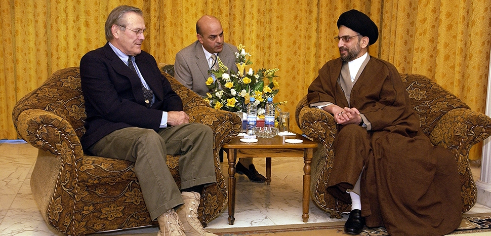 DoD photo by Tech. Sgt. Andy Dunaway, U.S. Air Force., modfiied, https://en.wikipedia.org/wiki/File:Donald_Rumsfeld_meets_Abdul_Aziz_al-Hakim,_2003-Dec-06.jpg