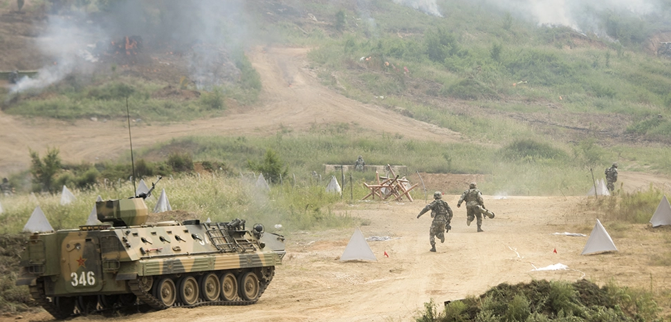                 Marine Corps Gen. Joseph F. Dunford Jr., chairman of the Joint Chiefs of Staff, observes an attack exercise with People's Liberation Army Gen. Song Puxuan, commander, Northern Theater Command, at a PLA base in Shenyang, China, Aug. 16, 2017. (DOD photo by U.S. Navy Petty Officer 1st Class Dominique A. Pineiro) / https://www.flickr.com/photos/thejointstaff/36558137376
              