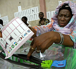 Woman holding note pad in Nigeria