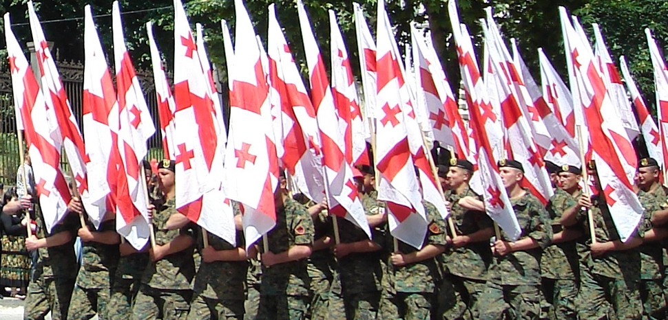 cc Kober, modified, https://commons.wikimedia.org/wiki/File:Flags_of_Georgia_in_Rustaveli_Avenue,_Tbilisi,_on_a_military_parade_during_the_Independence_Day_celebration_%28May_26,_2008%29.jpg