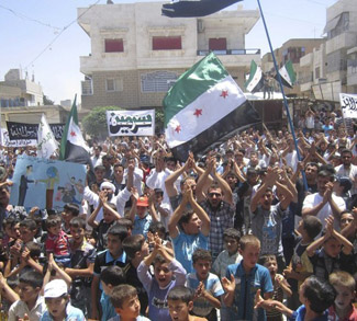 Demonstrators protest against Syria's President Bashar al-Assad after Friday prayers in Sermeen