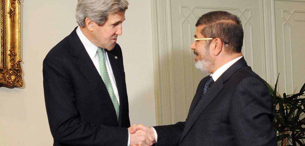 cc US Department of State, modified, https://commons.wikimedia.org/wiki/File:Secretary_Kerry_Meets_With_Egyptian_President_Mohammed_Morsi.jpg