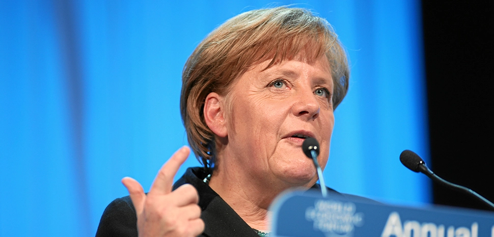                 cc WEF, modified, https://commons.wikimedia.org/wiki/File:Angela_Merkel_-_World_Economic_Forum_Annual_Meeting_2012.jpg / Angela Merkel, Federal Chancellor of Germany at the Annual Meeting 2012 of the World Economic Forum at the congress centre in Davos, Switzerland, January 25, 2012.
              