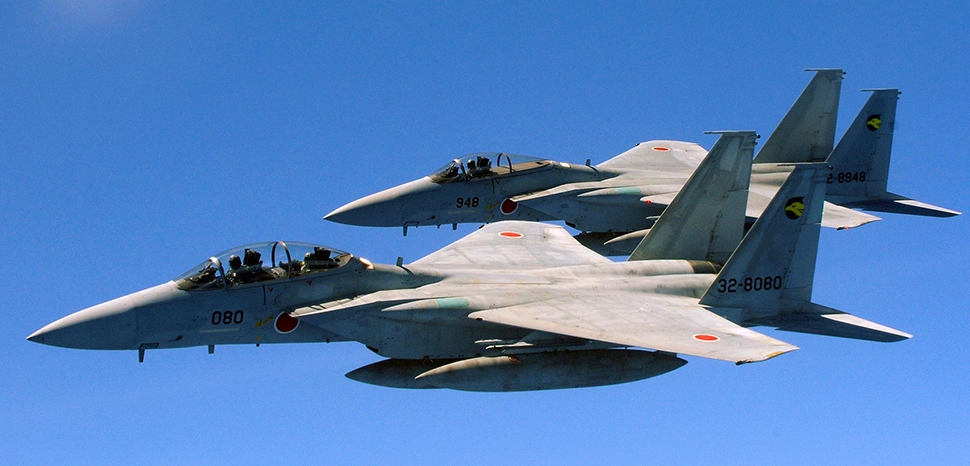                 cc Angelique Perez, U.S. Air Force / modified / Two Japan Air Self Defense Force F-15's fly alongside a U.S. Air Force KC-135 from the 909th Air Refueling Squadron, Kadena Air Base, during air refueling training July 30. / https://en.m.wikipedia.org/wiki/File:Two_Japan_Air_Self_Defense_Force_F-15_jets.jpg
              