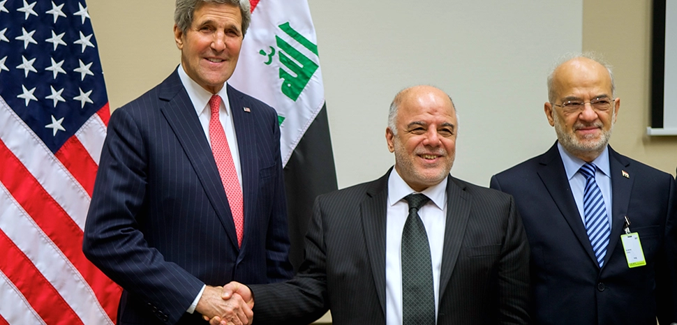 U.S. Secretary of State John Kerry shakes hands with Iraqi Prime Minister Haider al-Abadi before beginning a bilateral conversation that preceded a meeting of more than 60 anti-ISIL coalition parties held on December 3, 2014, at NATO Headquarters in Brussels, Belgium. / modified, cc US Department of State, https://commons.wikimedia.org/wiki/File:Secretary_Kerry_Shakes_Hands_With_Iraqi_Prime_Minister_al-Abadi_Before_Bilateral_Meeting_at_NATO_Headquarters_in_Belgium_%2815934729591%29.jpg