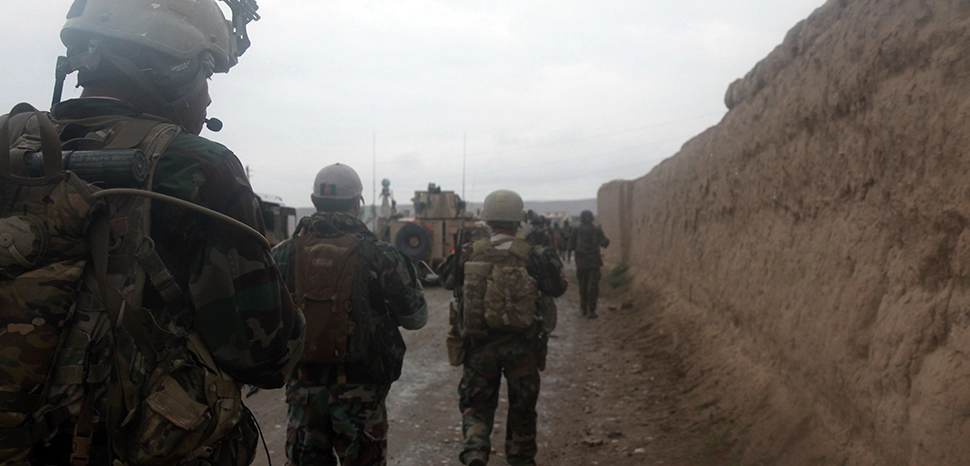                 Afghan National Army soldiers with the 5th Commando Kandak conduct a patrol and clearing operation in Boz Qandahari, Kunduz district, Kunduz province, Afghanistan, April 28, 2012. The commandos, assisted by coalition special operations forces, conducted the patrol in an effort to establish security and disrupt insurgent activities in the region. / cc SPC Robin Davis, modified, https://commons.wikimedia.org/wiki/File:Afghan_National_Army_soldiers_with_the_5th_Commando_Kandak_conduct_a_patrol_and_clearing_operation_in_Boz_Qandahari,_Kunduz_district,_Kunduz_province,_Afghanistan,_April_28,_2012_120428-A-BT925-006.jpg
              
