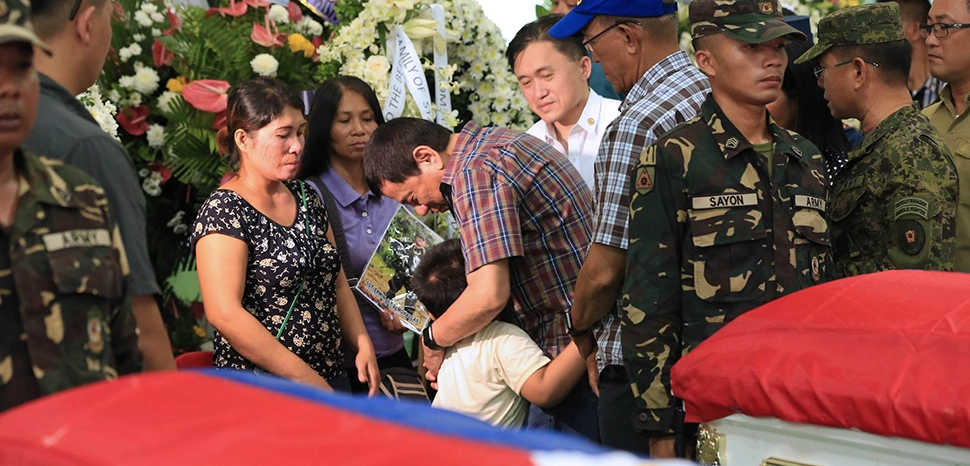                 cc REY BANIQUET/PPD, modified, https://commons.wikimedia.org/wiki/File:President_Rodrigo_R._Duterte_condoles_with_the_relatives_of_the_15_soldiers_killed_in_Abu_Sayyaf_encounter.jpg
              