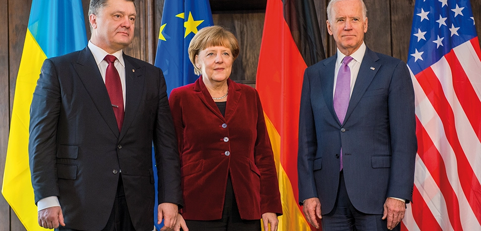                 cc Marc Müller (1984–) wikidata:Q59276133, modified, 51st Munich Security Conference 2015: Petro Poroschenko (President, Ukraine), Dr. Angela Merkel (Federal Chancellor, Federal Republic of Germany), Joseph R. Biden Jr. (Vice President, United States of America) https://en.m.wikipedia.org/wiki/File:Poroschenko_Merkel_and_Biden_Security_Conference_February_2015.jpg
              
