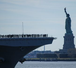 NEW YORK (Nov. 10, 2016) -- USS Iwo Jima (LHD 7) sails past the Statue of Liberty as it enters New York Harbor prior to Veterans Week NYC 2016 which honors the service of all our nation’s veterans. The approximately 1,000 Sailors and more than 100 Marines on board Iwo Jima will participate in a number of events throughout the city, including the Veterans Day parade Nov. 11. The ship recently returned from the humanitarian assistance mission to Haiti in the aftermath of Hurricane Matthew #USNavy #NYC #VeteransDay #NeverForget (U.S. Navy photo by Petty Officer 2nd Class Carla Giglio/Released)