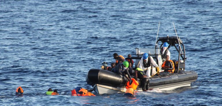 An Irish boat rescues migrants off the coast of Tripoli; cc Flickr Irish Defence Forces, modified, https://creativecommons.org/licenses/by/2.0/