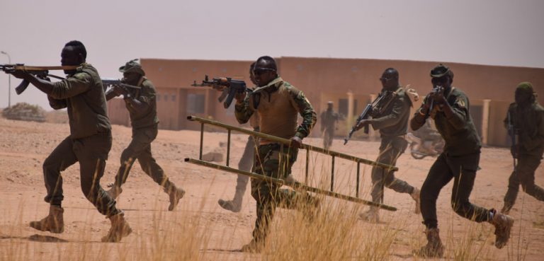 Forces Armees Nigeriennes soldiers advane on a notional enemy position in a training mission during Exercise Flintlock 2018 at Agadez, Niger, April 17, 2018. Flintlock is an annual, African-led, integrated military and law enforcement exercise that has strengthened key partner nation forces throughout North and West Africa as well as western Special Operations Forces since 2005. (U.S. Army photo by Sgt. 1st Class Mary S. Katzenberger, 3rd Special Forces Group (Airborne)/Released)