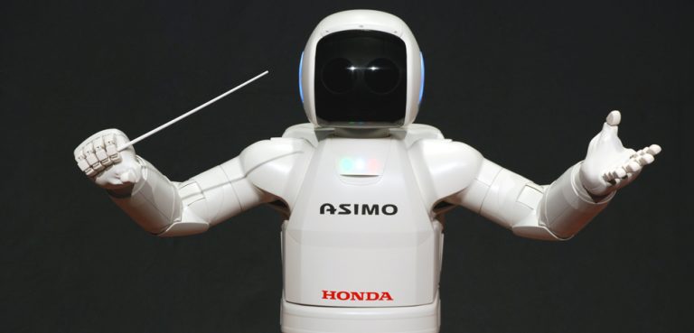 ASIMO conducting post, CC Vanillase, modified, https://commons.wikimedia.org/wiki/File:ASIMO_Conducting_Pose_on_4.14.2008.jpg