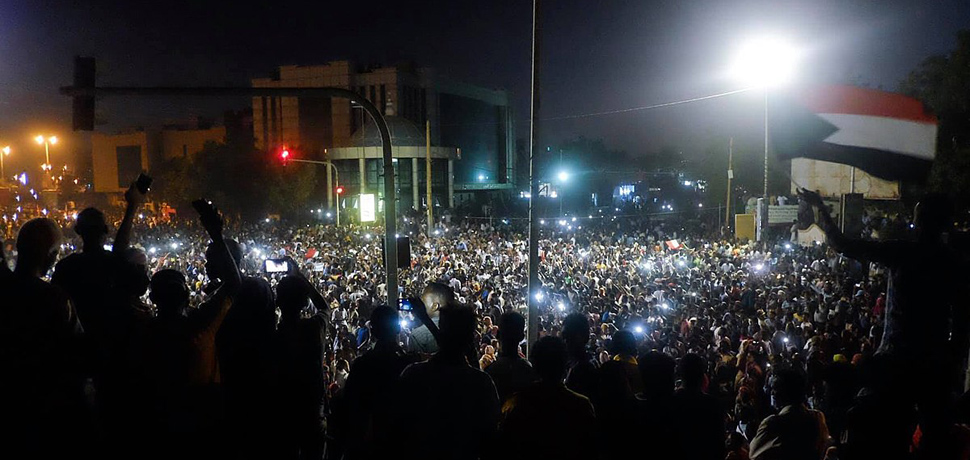                 Protest in Khartoum near army HQ, cc M. Saleh, modified, https://commons.wikimedia.org/w/index.php?title=Special:Search&title=Special:Search&redirs=0&search=khartoum+protest&fulltext=Search&fulltext=Advanced+search&ns0=1&ns6=1&ns14=1&advanced=1&searchToken=6nlw8xdx3i85u6thqgb3fvhfr#%2Fmedia%2FFile%3ASudanese_protestors_gathering_infront_of_Army_HQ.jpg
              