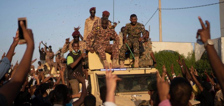 SudanProtests, cc Wiki Commons, M. Saleh, modified, https://commons.wikimedia.org/wiki/Category:2019_Sudanese_protests#/media/File:Sudanese_protestors_greeting_sudanese_army.jpg