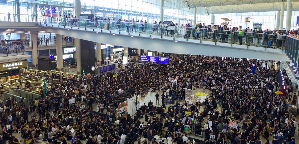                 Hong Kong sit-in airport protest, cc Wpcpey, modified, https://commons.wikimedia.org/wiki/File:HK_airport_sit-in_protest_20190726.jpg
              