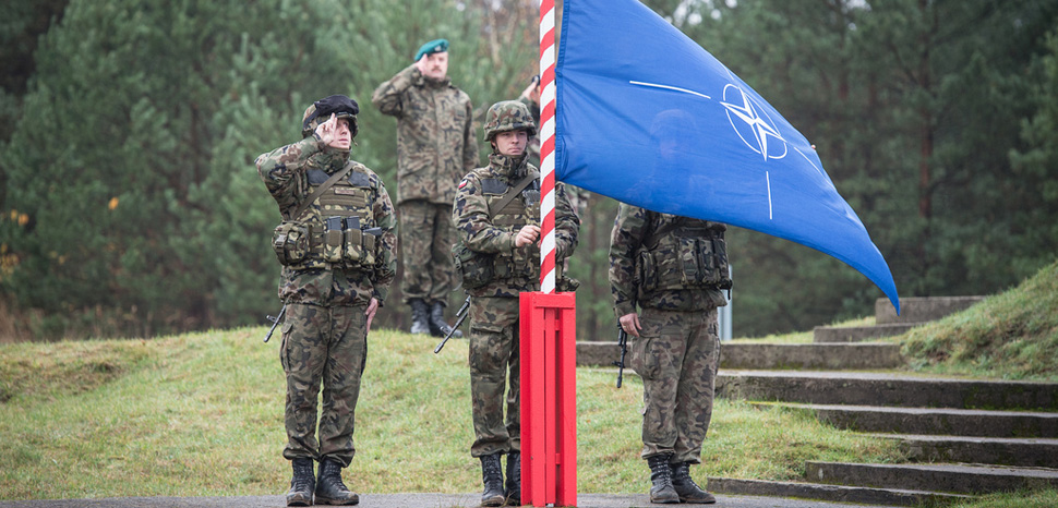                 Natoflag, cc Flickr U.S. Army Europe, modified, https://creativecommons.org/publicdomain/mark/1.0/
              