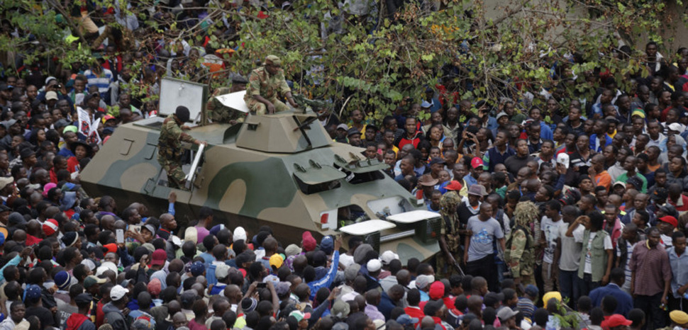 An APC navigates a crowd during anti-Mugabe demonstrations in Zimbabwe. CC Flickr Zimbabwean-eyes, modified, https://creativecommons.org/publicdomain/mark/1.0/