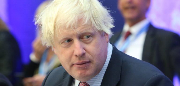 Boris Johnson, modified, cc EU2017EE Estonian Presidency, https://commons.wikimedia.org/wiki/File:Informal_meeting_of_foreign_affairs_ministers_(Gymnich)._Round_table_Boris_Johnson_(36913612672)_(cropped).jpg