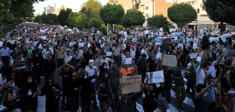 A picture from the Tehran protests of 2009, cc Milad Avazbeigi, modified, https://commons.wikimedia.org/wiki/File:Tehran_protests_(2).jpg