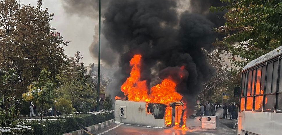 Iran Fuel Protests, cc Fars News Agency, wikicommons, modified, https://commons.wikimedia.org/w/index.php?title=Special:Search&limit=500&offset=0&ns0=1&ns6=1&ns14=1&search=iran+protest&advancedSearch-current=%7B%7D&searchToken=7b2lb0b650k35fu08drjgghrf#%2Fmedia%2FFile%3A2019_Iranian_fuel_protests_Fars_News_%282%29.jpg