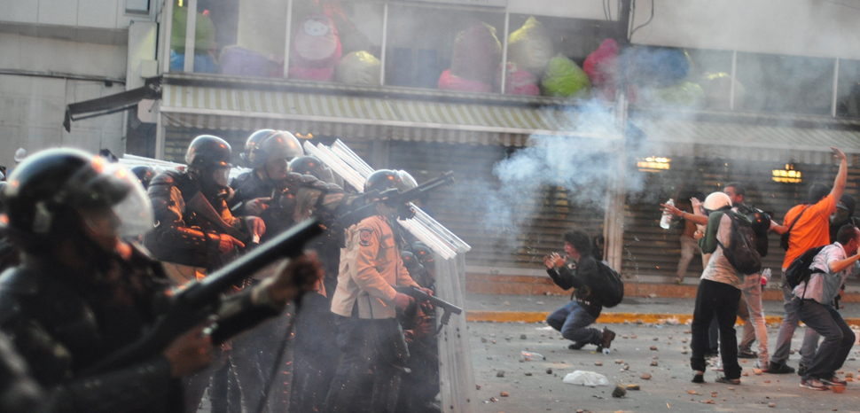 Tear gas, and plastic pellet gunshot used by Venezuela's National Police against a protest in Altamira, Caracas., cc Andrés E. Azpúrua, modiofied, https://commons.wikimedia.org/wiki/File:Tear_gas_used_against_protest_in_Altamira,_Caracas;_and_distressed_students_in_front_of_police_line.jpg