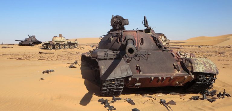 Three old Libyan tanks, derelict after the failed intervention in the Chadian civil war. cc Flickr David Stanley, modified, https://creativecommons.org/licenses/by/2.0/
