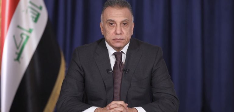 Iraqi Prime Minister Mustafa al-Kadhimi, modified, cc The Media Office of the Prime Minister of Iraq, https://commons.wikimedia.org/wiki/File:Mustafa_al-Kadhimi.jpg