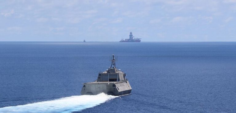 public domain, modified, https://www.amphib7flt.navy.mil/Media/News/Article/2180588/montgomery-cesar-chavez-operate-near-west-capella/, SOUTH CHINA SEA (May 7, 2020) The Independence-variant littoral combat ship USS Montgomery (LCS 8) conducts routine operations near Panamanian flagged drillship, West Capella, May 7. Montgomery is on a rotational deployment to USINDOPACOM, conducting operations, exercises and port visits throughout the region and working hull-to-hull with allied and partner navies to provide maritime security and stability, key pillars of a free and open Indo-Pacific. (U.S. Navy photo by Naval Aircrewmen Helicopter 3rd Class Christopher Fred) (Photo by AWS3 Christopher Fred)