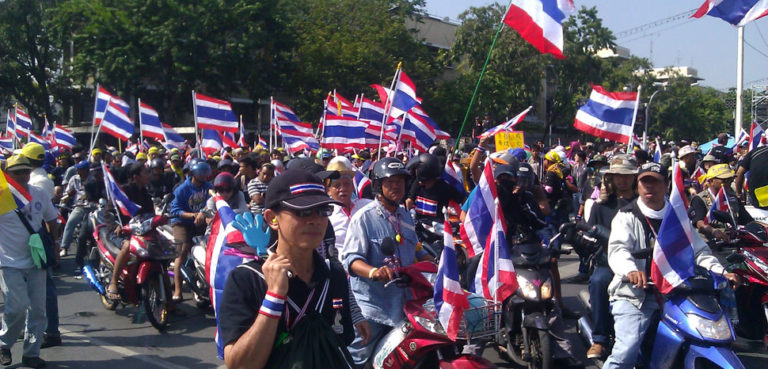 Thai protests in 2013, cc ilf_, modified, https://commons.wikimedia.org/wiki/File:Protesters_on_motorcycles_in_Bangkok,_1_December_2013.jpg