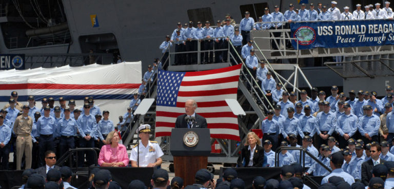 NAVAL AIR STATION, North Island (May 14, 2009) Vice President Joe Biden addresses the crew of the Nimitz-class aircraft carrier USS Ronald Reagan (CVN 76). The Vice President and his wife, Dr. Jill Biden, visited Ronald Reagan during a familiarization tour of naval facilities in the San Diego area. Ronald Reagan is preparing for its upcoming deployment to the Western Pacific and Indian Ocean later this spring. (U.S. Navy photo by Mass Communication Specialist 3rd Class Briana C. Brotzman/Released), modified, US Navy, https://commons.wikimedia.org/wiki/File:US_Navy_090514-N-2344B-204_Vice_President_Joe_Biden_addresses_the_crew_of_the_Nimitz-class_aircraft_carrier_USS_Ronald_Reagan_(CVN_76).jpg