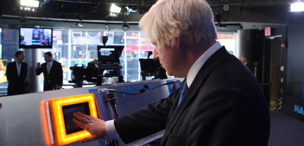Mayor of London, Boris Johnson pushes the opening bell at NASDAQ the morning of 9/14/09 as part of Think London's digital breakfast.cc Flickr Think London, modified, https://www.flickr.com/photos/thinklondonevents/3919827072/in/photolist-6Yo92o-4PpYva-UnJvd5-5NHpq4-W5yxy2-cCdaXW-cCdaLC-2h5PSg9-J6Wtnb-hDfSP2-2gdT5Q5-2gFRENT-9oTK3U-Ka35St-2gHmhVR-2jdHZUg-58L4Mx-2iHUfKZ-bCHbSz-2gLQQAV-2gLQQpn-2gLQQvp-2iGnDHp-2gLRBcK-2hAp5yR-2gHmhSj-2hmvArX-4KDYDW-KgtJoC-2hAp5xi-6Ypvrs-2gLRBg7-e4SttF-2iGnDFq-YdncbS-2gLQS8x-NJNKMW-L4J27Y-Yhvp1i-2gLQQMX-2gLQQWV-2gLRBMc-2gLRByX-2gLRBWf-2gLQRnE-2gLRBnu-2gLQRLW-2gLRCxq-2gLQRUw-2gLQQtf