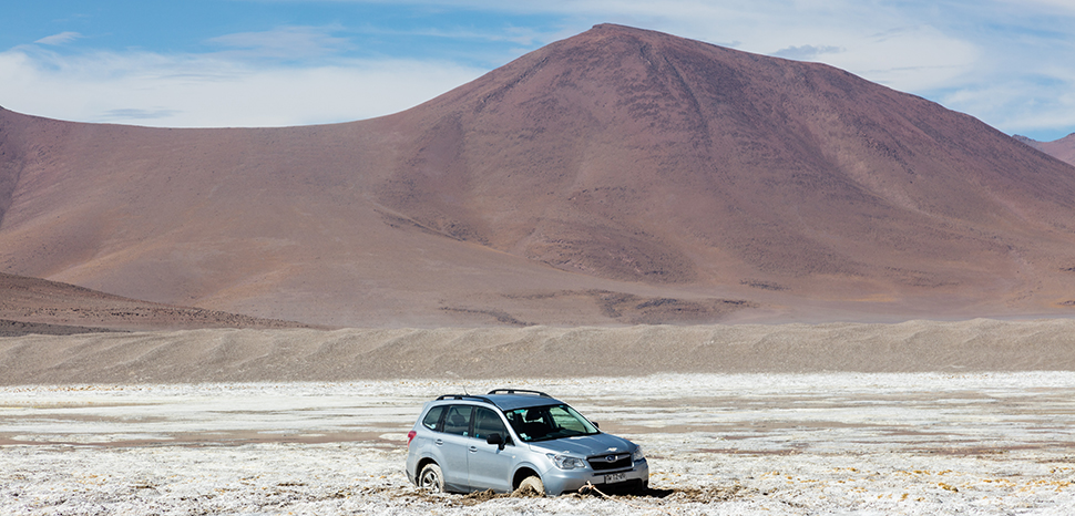 A vehicle in one of Chile's salt flats. cc Diego Delso, modified, https://commons.wikimedia.org/wiki/File:Salar_de_Pujsa,_Chile,_2016-02-08,_DD_01.JPG