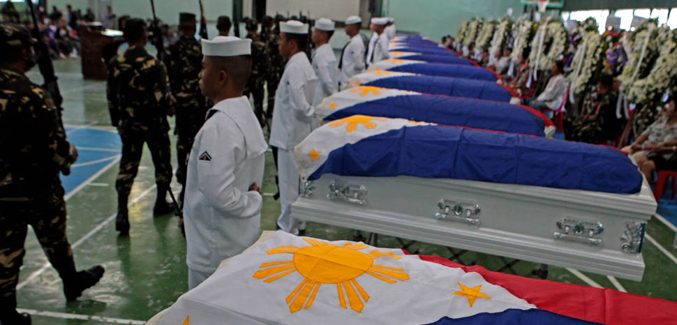 Military honors bestowed on 15 AFP soldiers killed in combat against Abu Sayyaf in 2016, public domain, ROBINSON NIÑAL/PPD, modified, https://commons.wikimedia.org/wiki/File:The_15_gallant_soldiers_killed_in_combat_with_the_Abu_Sayyaf_in_Sulu_are_given_full_military_honors.jpg