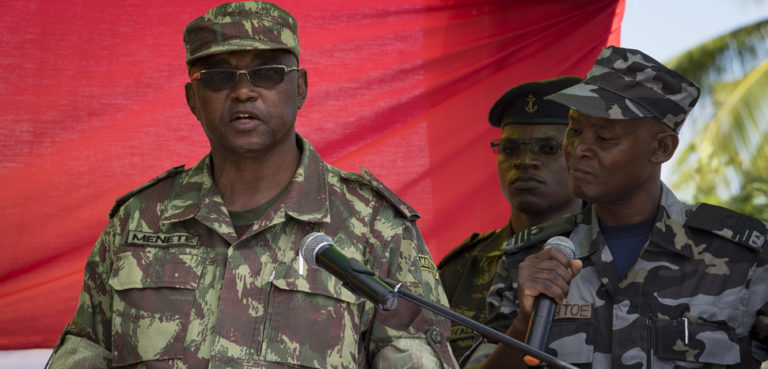 PEMBA, Mozambique (Jan. 29, 2019) General of the Army Lazaro Menete, chief of staff of the Mozambican Armed Forces, speaks during the opening ceremony of exercise Cutlass Express 2019 in Pemba, Mozambique, Jan. 29, 2019. Cutlass Express is designed to improve regional cooperation, maritime domain awareness and information sharing practices to increase capabilities between the U.S., East African and Western Indian Ocean nations to counter illicit maritime activity. (U.S. Navy photo by Mass Communication Specialist 1st Class Kyle Steckler/Released), cc Flickr modified, Commander, U.S. Naval Forces Europe-Africa/U.S. 6th Fleet, https://flickr.com/photos/cne-cna-c6f/46004465185/in/photolist-2kNQP1b-2h7cNbz-8uNQKo-7WrvjL-9ptDm4-9s7aPC-8uNPNs-8uKMLK-8EqYsv-8EqYkH-8Eu8zd-7Wofq6-8uNPLJ-8vgTKg-8uKLGt-6tCvpF-8uNR1o-8uKMkt-8uKN4r-8uKLDc-8ygV66-8yjYqJ-8uKKTx-8uKNiK-nSVh8c-8uKLt6-8uNQYG-8uNQH9-8uKNav-8uNPk3-8uKLBc-9phppg-8uNPX9-9s4bCX-9s4bR8-9s4bzR-8ygUZV-cXEWDW-cXEWpm-RhoVPm-cXEWdo-cXEVVL-2d6fUpB-2d6fUJe-cXEW6b-cXEW2o-cXEWjm-cXEVSu-9qhgiS