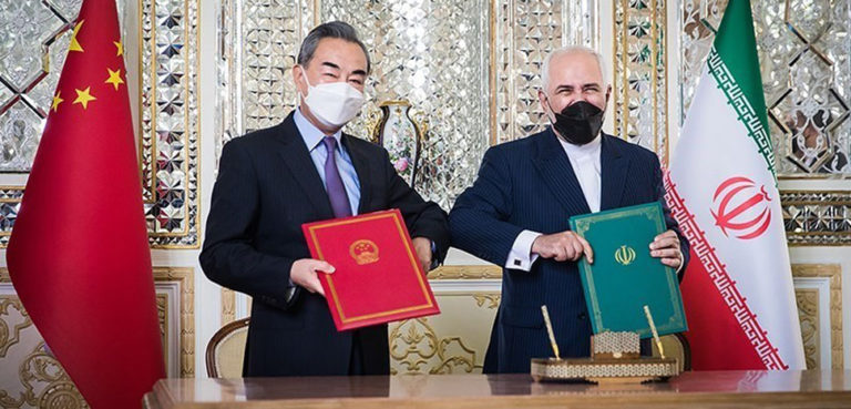 Iranian Foreign Minister Mohammad Javad Zarif and State Councilor of the People’s Republic of China Wang Yi Signing the Iran–China 25-year Cooperation Program in Tehran, cc Tansim News, Erfan Kouchari, modified, https://commons.wikimedia.org/wiki/File:Zarif_and_Wang_Yi_Signing_Iran%E2%80%93China_25-year_Cooperation_Program_3.jpg
