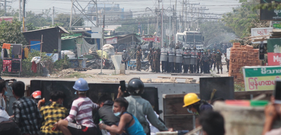 VOA news, modified, https://commons.wikimedia.org/wiki/File:Protesters_and_police_face_off_in_Mandalay.webp