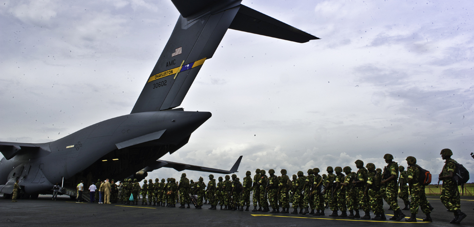 cc Flickr U.S. Army Southern European Task Force, Africa, modified, Burundi soldiers prepare to load onto a C-17 Globemaster Dec. 13, 2013 at Bujmumbura Airport, Burundi. In coordination with the French military and African Union, the U.S. military provided airlift support to transport Burundi soldiers, food and supplies in the Central African Republic (CAR). This support is aimed at enabling African forces to deploy promptly to prevent further spread of sectarian violence and restore security in CAR. (U.S. Air Force photo by Staff Sgt. Erik Cardenas)