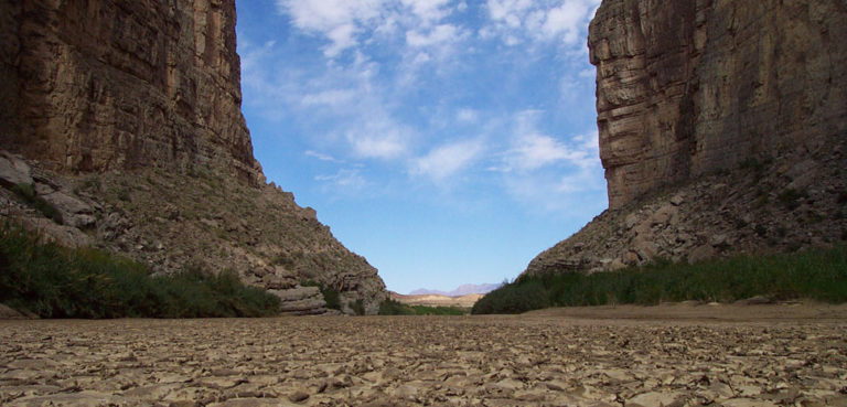 Dry riverbed in Santa Elena Canyon in Big Bend National Park, Texas, United States. Rio Grande facing downstream (Mexico on right, United States on left). Note: The river was flowing adjacent, large enough for people to canoe down it. This photo is a closeup of a sand bar., cc SCEhardt, modified, public domain, https://en.wikipedia.org/wiki/File:Big_Bend_National_Park_-_Rio_Grande_riverbed_with_cracked_mud.jpg