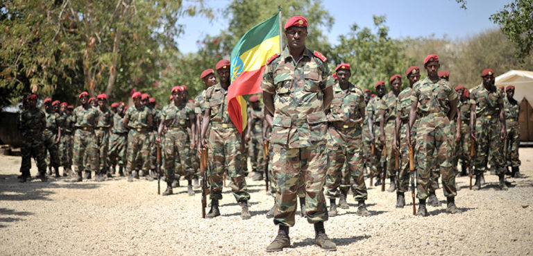 cc AMISOM Public Information, modified, Members of the Ethiopian National Defense Forces stand in formation during a ceremony in Baidoa, Somalia, to mark the inclusion of Ethiopia into the African Union peace keeping mission in the country on January 22. AU UN IST PHOTO / Tobin Jones