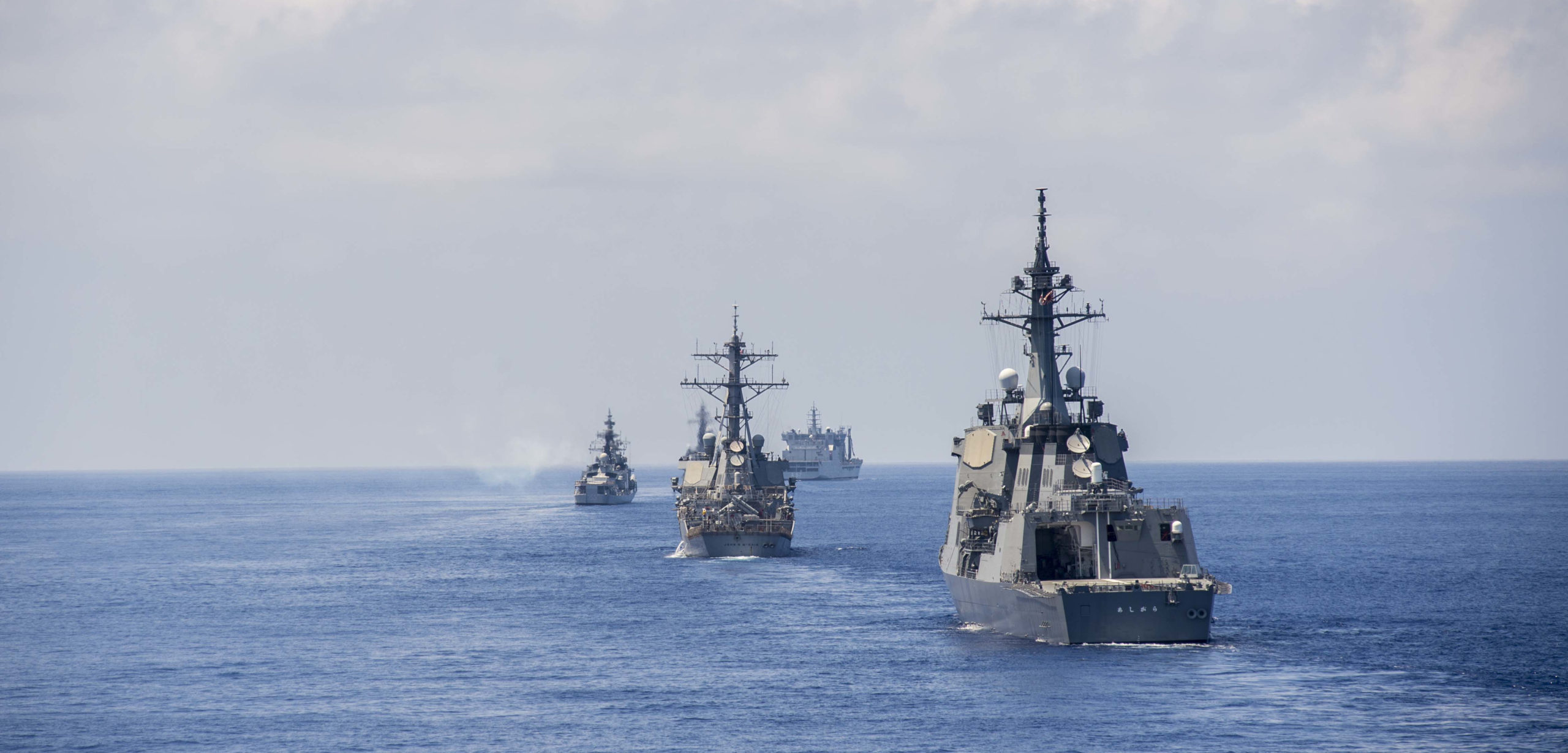 140727-N-TU910-014 EAST CHINA SEA (July 27, 2014) ) Ships assigned to Japan Maritime Self-Defense Force, Indian Navy, and U.S. Navy steam alongside Ticonderoga-class guided-missile destroyer USS Shiloh (CG 67) during Malabar 2014. Malabar 2014 is a U.S. Navy, Indian Navy, Japan Maritime Self-Defense Force trilateral naval field training exercise aimed to improve our collective maritime relationship and increase understanding in multinational operations. (U.S. Navy photo released by Mass Communication Specialist Seaman Abby Rader/Released), cc Naval Surface Warriors Flickr, modified