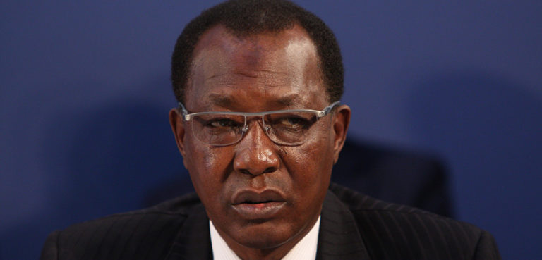President Idriss Deby, the long-serving ruler of Chad and father to the current president, pictured in 2014; modified; cc Foreign and Commonwealth Office, https://commons.wikimedia.org/w/index.php?title=Special:Search&limit=500&offset=0&ns0=1&ns6=1&ns14=1&search=president+deby#/media/File:London_Conference_on_The_Illegal_Wildlife_Trade_(12499088055).jpg