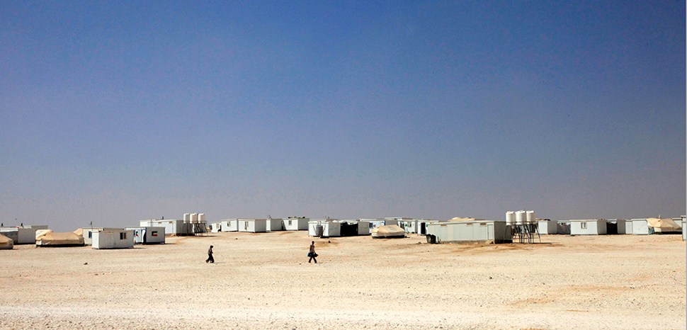 Zaatari, a Syrian refugee camp in Jordan; modified, cc DFID - UK Department for In - https://flickr.com/photos/dfid/9638629918/in/photolist-fFJuSs-ZJEdf9-fFpuqZ-DfwHB6-DmUhuy-yBEimY-3gjNCY-BqciQi-oHV1Wq-DmMgoE-yno5KJ-fFFNTf-DCsCuG-i2p5sx-fNdBpo-CRtV4H-2mhBNPR-RJR7j7-RJ5e8N-DLy3yu-CRwjh2-DED7Bm-xj5B1W-xgVGPV-DEKSne-RNrF7e-uNuCXL-BzJqM3-yCZEt9-CRvpBU-i2pdau-2hzoWYA-i2nVF8-RuFoUS-JmcfqM-QyFbpg-poni9P-2nGgHRg-i2qiTF-DEJTzg-DfrZYe-DJVfQo-rjuRc1-RK4bgR-RdXGFq-JpSDr5-ponjvg-DCwg3f-QyFbQM-i2pni6