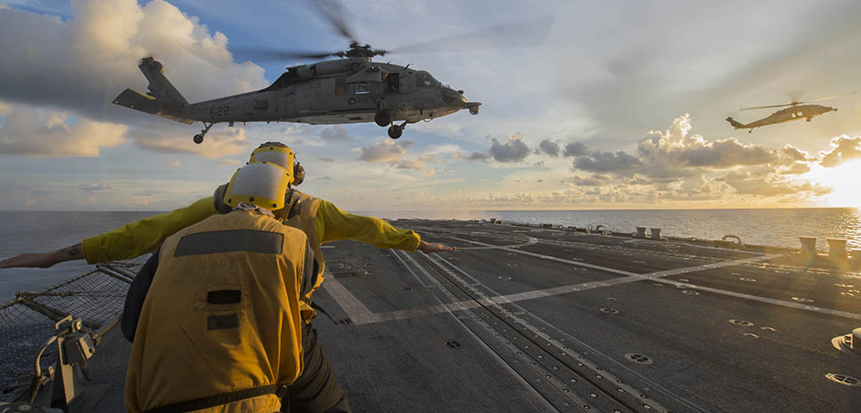 SOUTH CHINA SEA (July 22, 2016) Sailors signal to an MH-60S Sea Hawk helicopter attached to the “Golden Falcons” of Helicopter Sea Combat Squadron (HSC) 12 as it hovers over the flight deck of the Arleigh-Burke-class guided-missile destroyer USS McCampbell (DDG 85) during a visit, board, search and seizure training exercise. McCampbell is on patrol with the Carrier Strike Group Five (CSG 5) in the U.S. 7th Fleet area of responsibility supporting security and stability in the Indo-Asia-Pacific. (U.S. Navy photo by Mass Communication Specialist 3rd Class Elesia K. Patten/Released)160722-N-WM647-202 Join the conversation: http://www.navy.mil/viewGallery.asp http://www.facebook.com/USNavy http://www.twitter.com/USNavy http://navylive.dodlive.mil http://pinterest.com https://plus.google.com