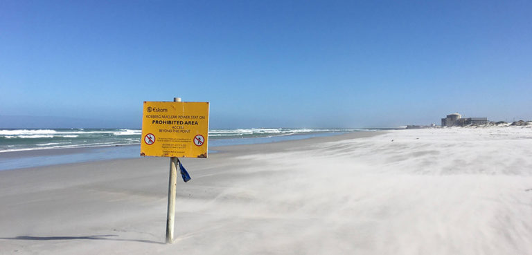 A Sign prohibiting access to the area near South Africa's Koeberg nuclear power plant in Cape Town; cc Louis Oelofse, modified, https://commons.wikimedia.org/w/index.php?search=africa+nuclear+plant&title=Special:Search&profile=advanced&fulltext=1&ns0=1&ns6=1&ns12=1&ns14=1&ns100=1&ns106=1#/media/File:Koeberg_Nuclear_Powerplant_-_Entry_Prohibited_beach_sign.jpg