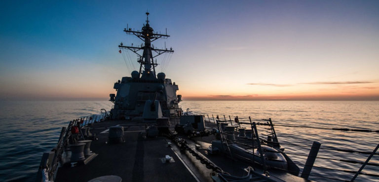 Ship moves through Strait of Gibraltor. The guided missile destroyer USS Jason Dunham transits the Strait of Gibraltar at dusk, June 14, 2018. The ship was conducting naval operations in the U.S. 6th Fleet area of operations in support of U.S. national security interests in Europe. During small-boat operations in the Red Sea, a sailor assigned to the ship died July 8, 2018. DoD photo by Navy Petty Officer 3rd Class Jonathan Clay